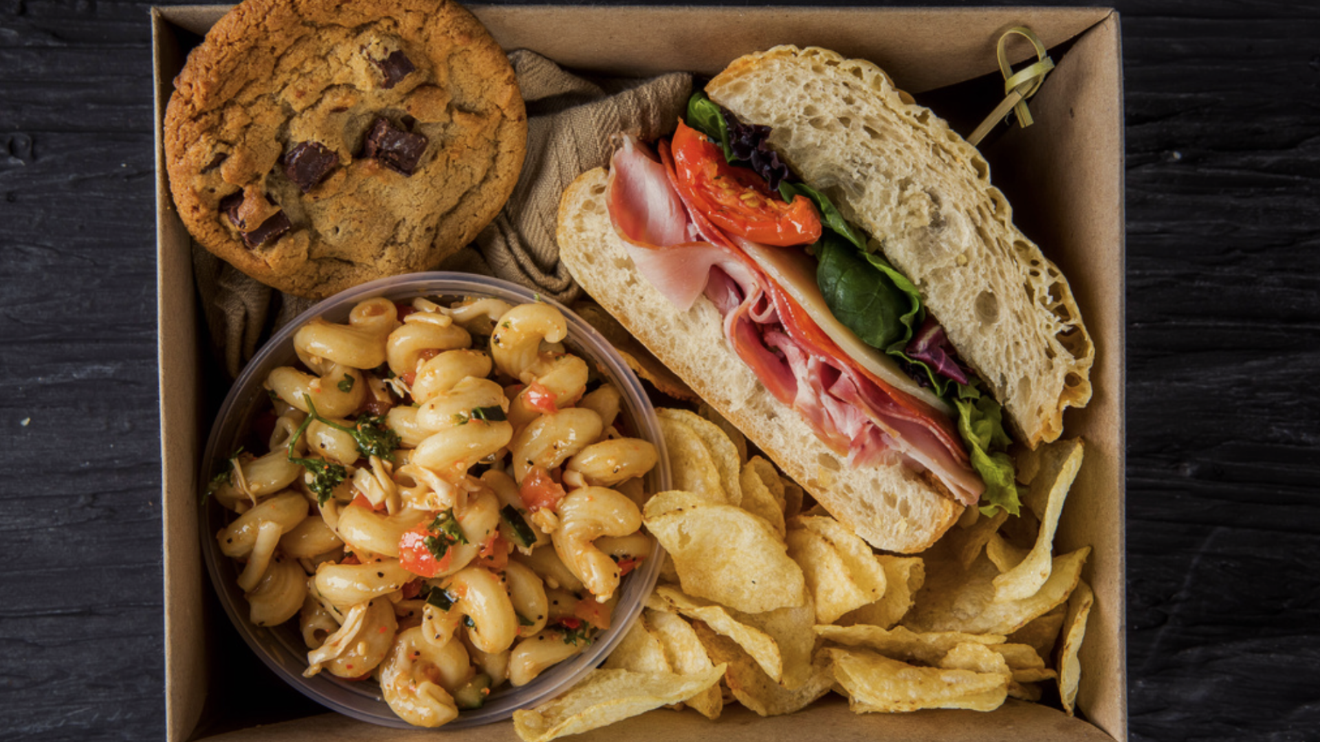 a sandwich sitting on top of a wooden table