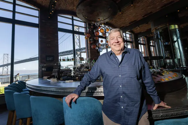 a man standing in a bar