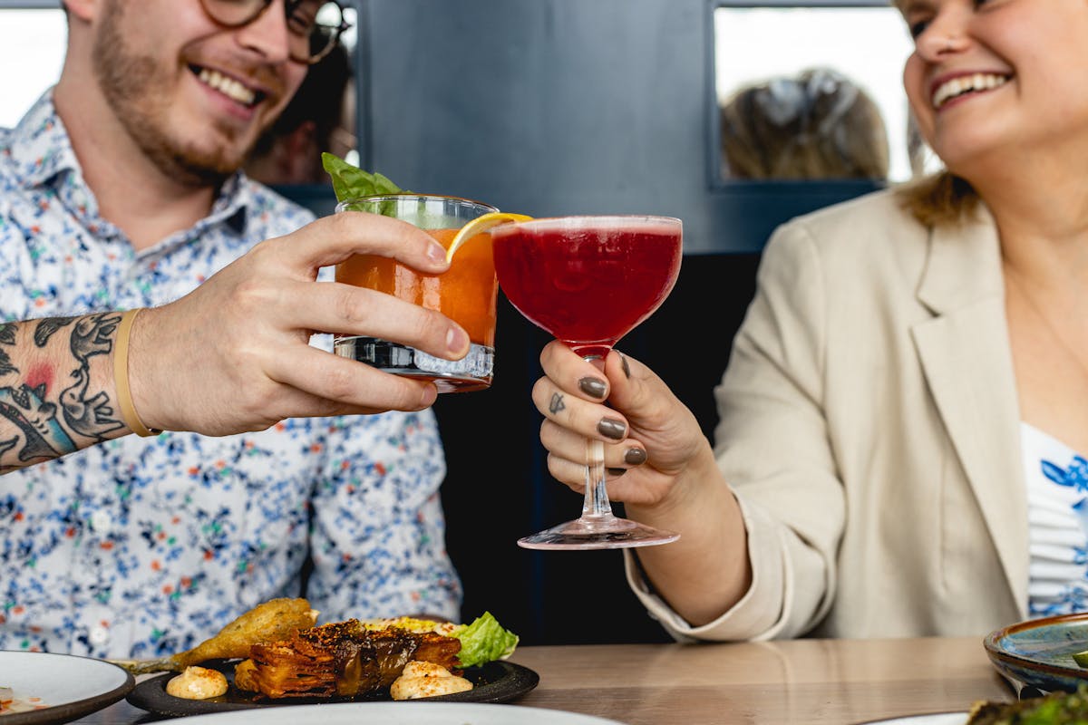 a person sitting at a table with a plate of food