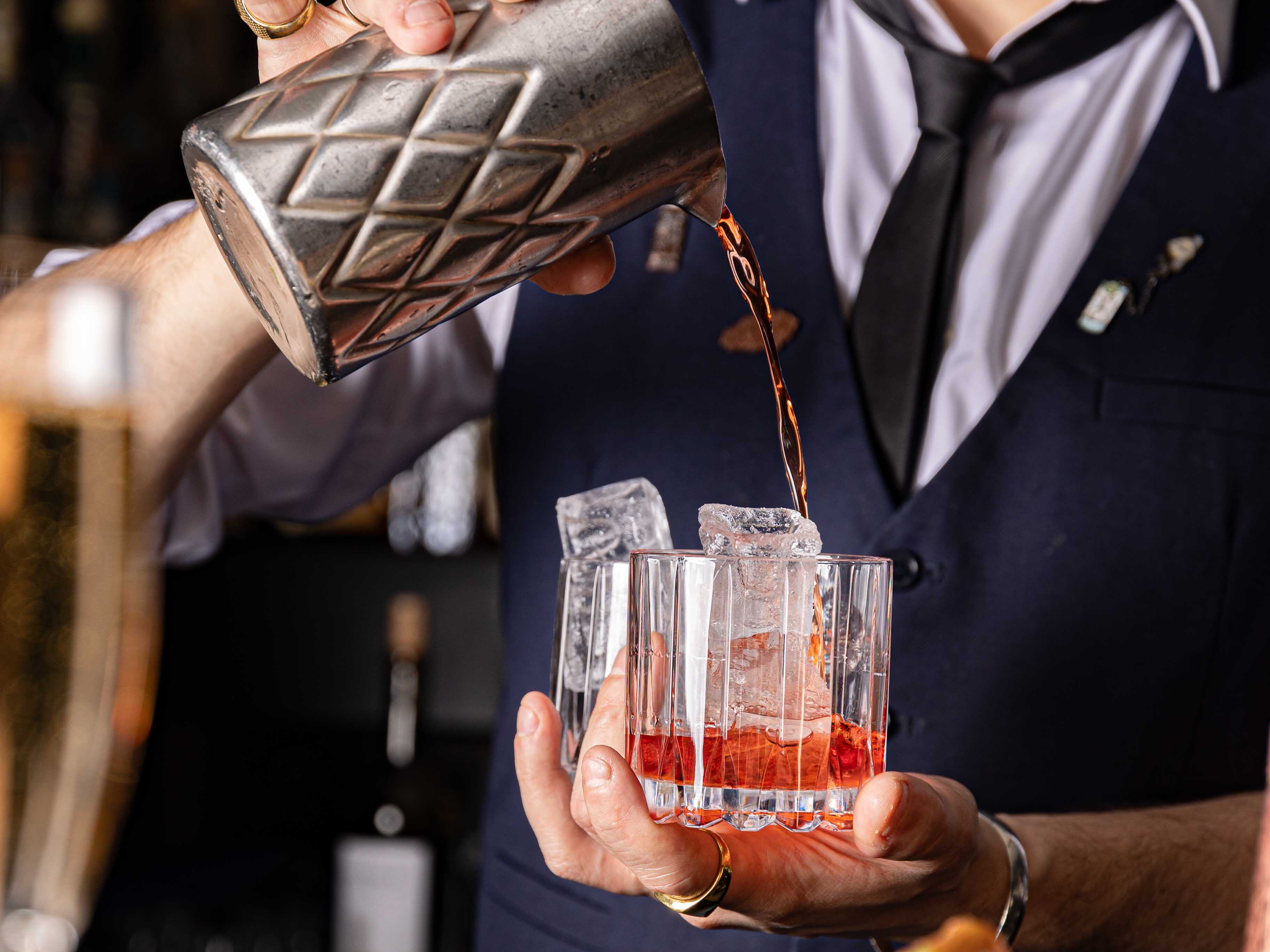 a person holding a glass of wine