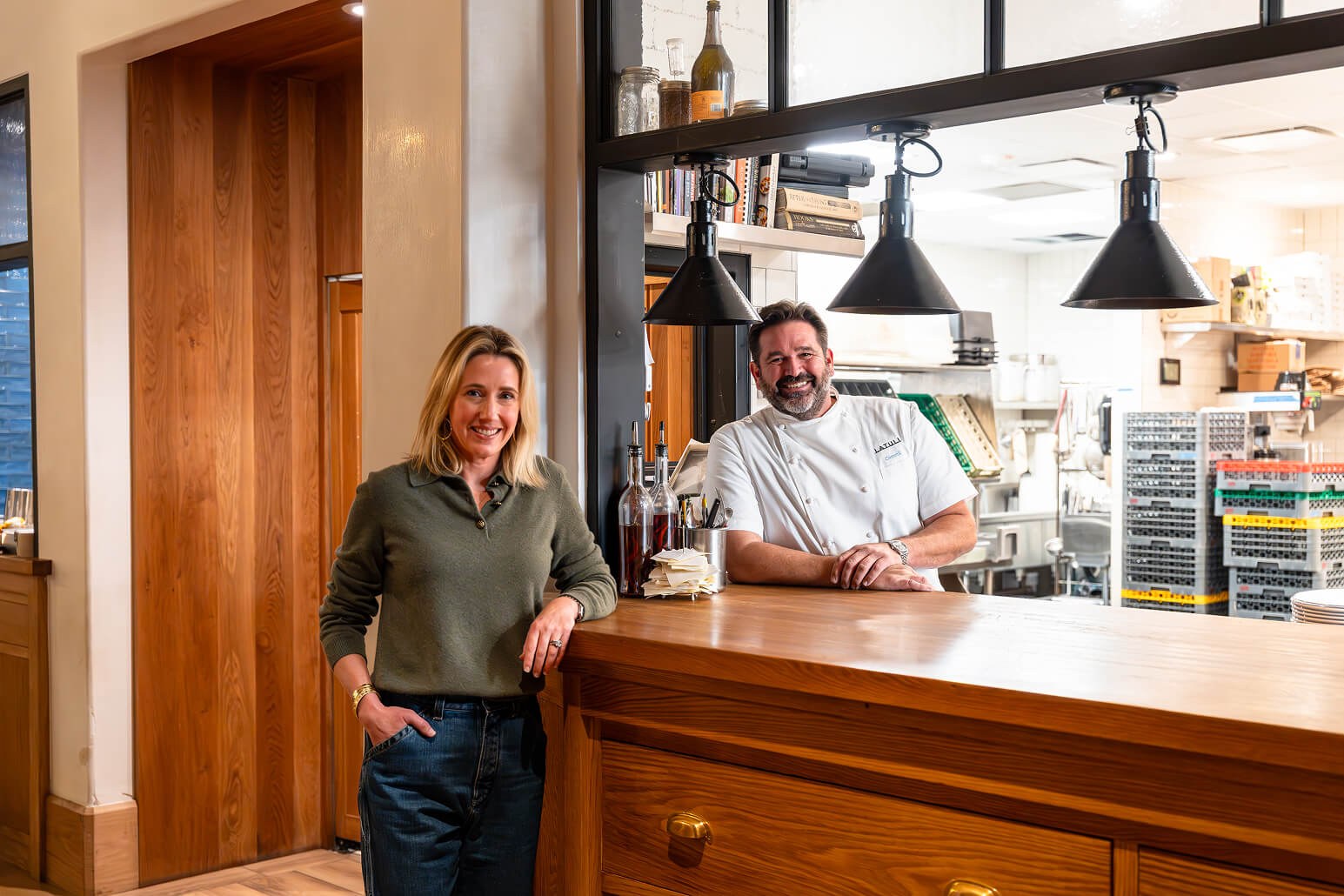 Allison Knight and Chef Bryan Caswell standing at the Latuli bar.