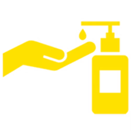 Hand pressing a pump dispenser on a bottle, likely containing sanitizer or soap.