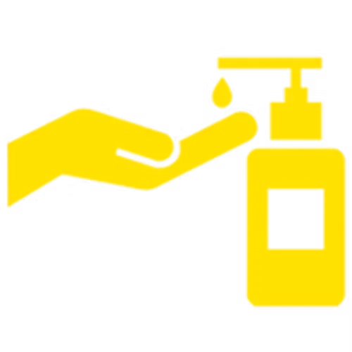Hand pressing a pump dispenser on a bottle, likely containing sanitizer or soap.