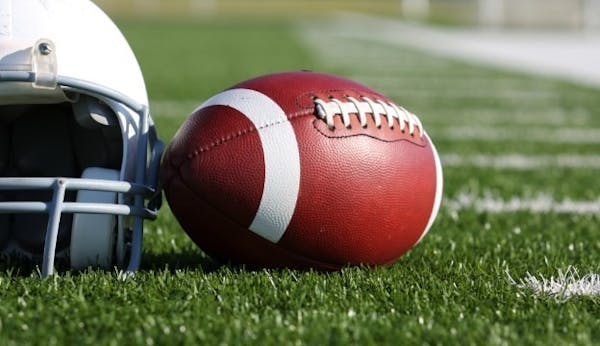 a close up of a football ball on a field
