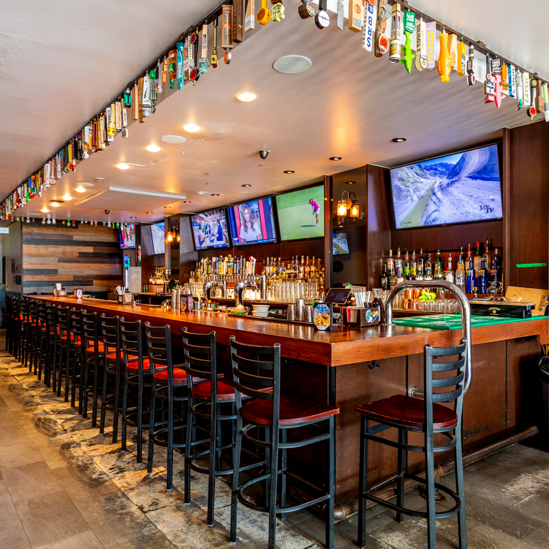 a close up of a bar with chairs