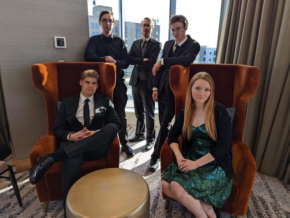 a group of people sitting at a table