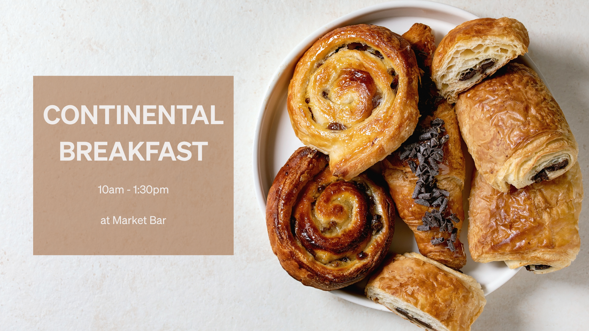 a plate of pastries on a white surface