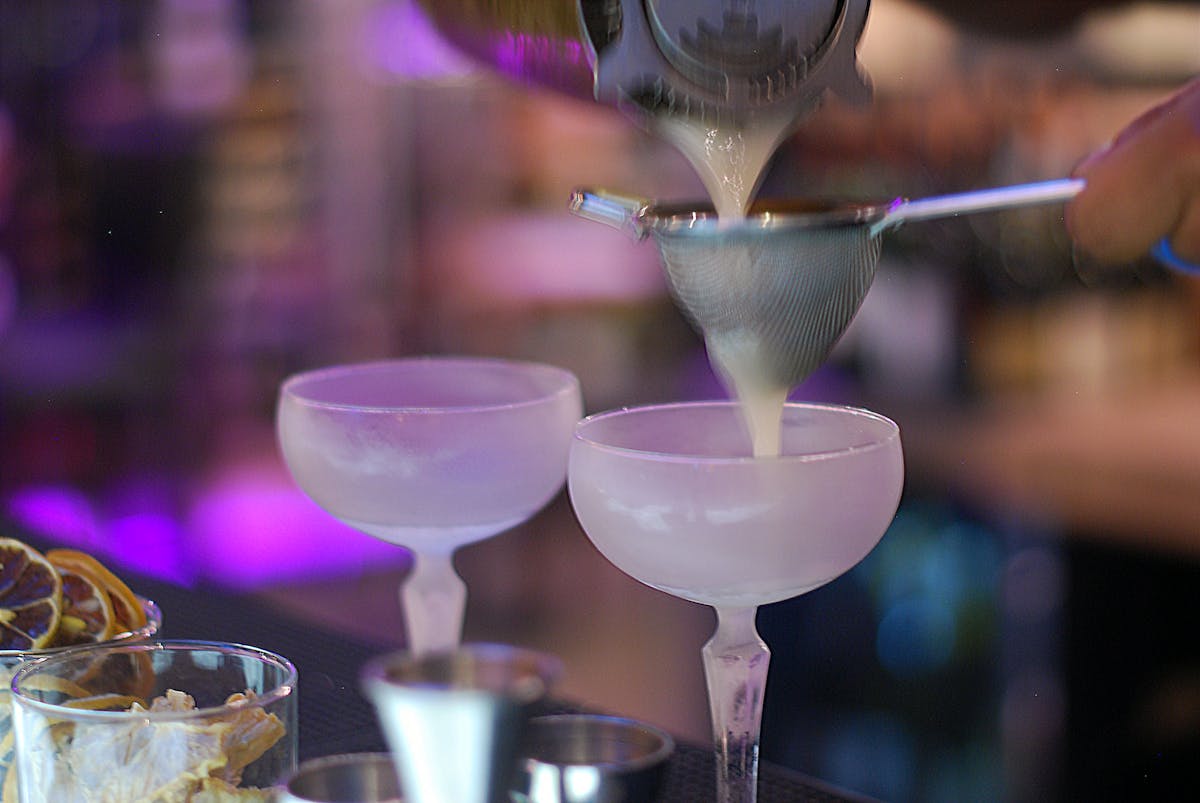 a close up of a cocktail drinks sitting on a table