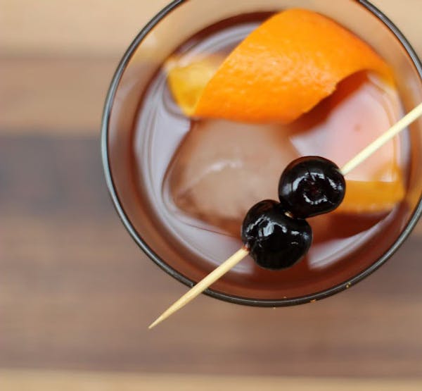 a bowl of oranges on a table