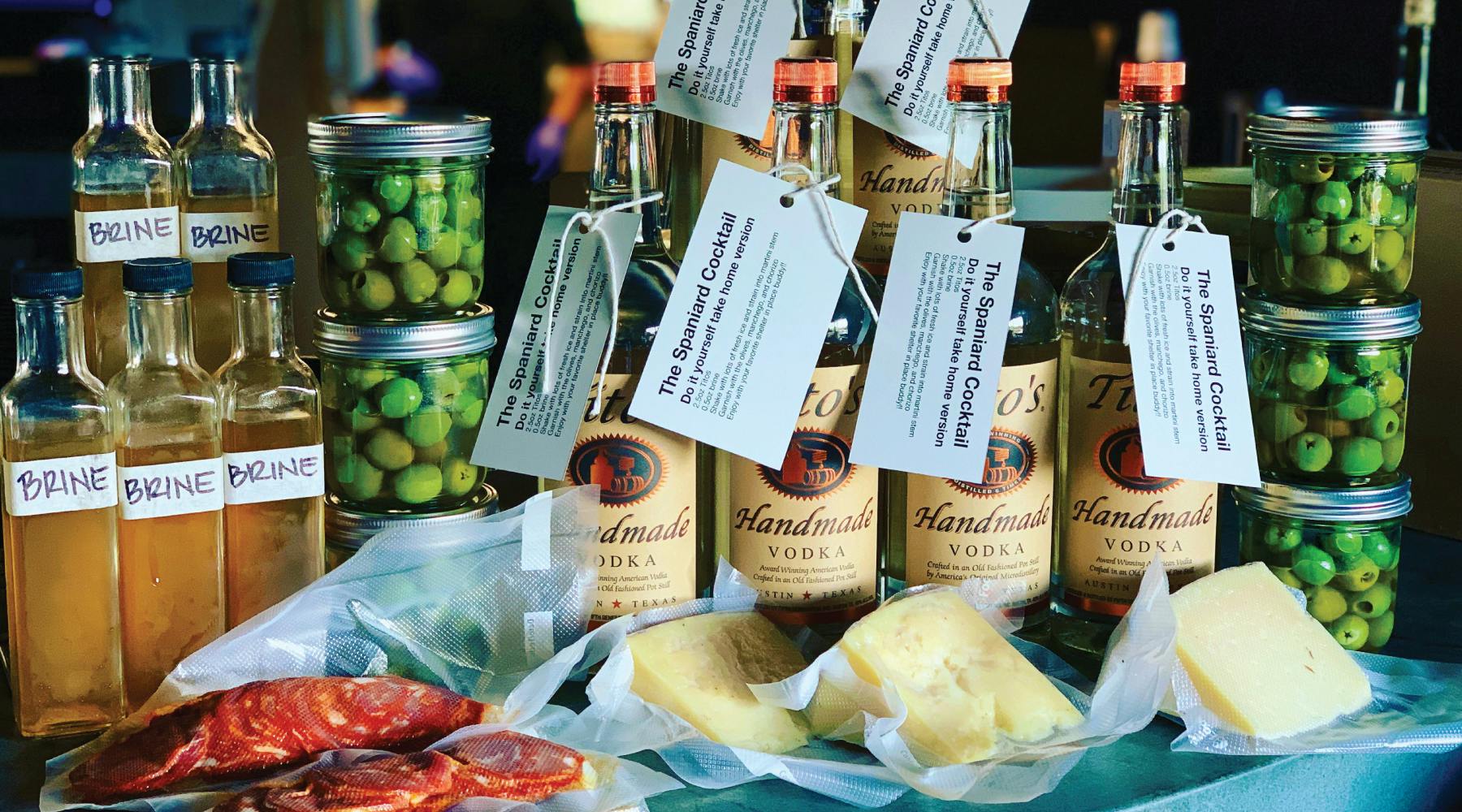 a bottle of wine sitting on top of a table filled with food