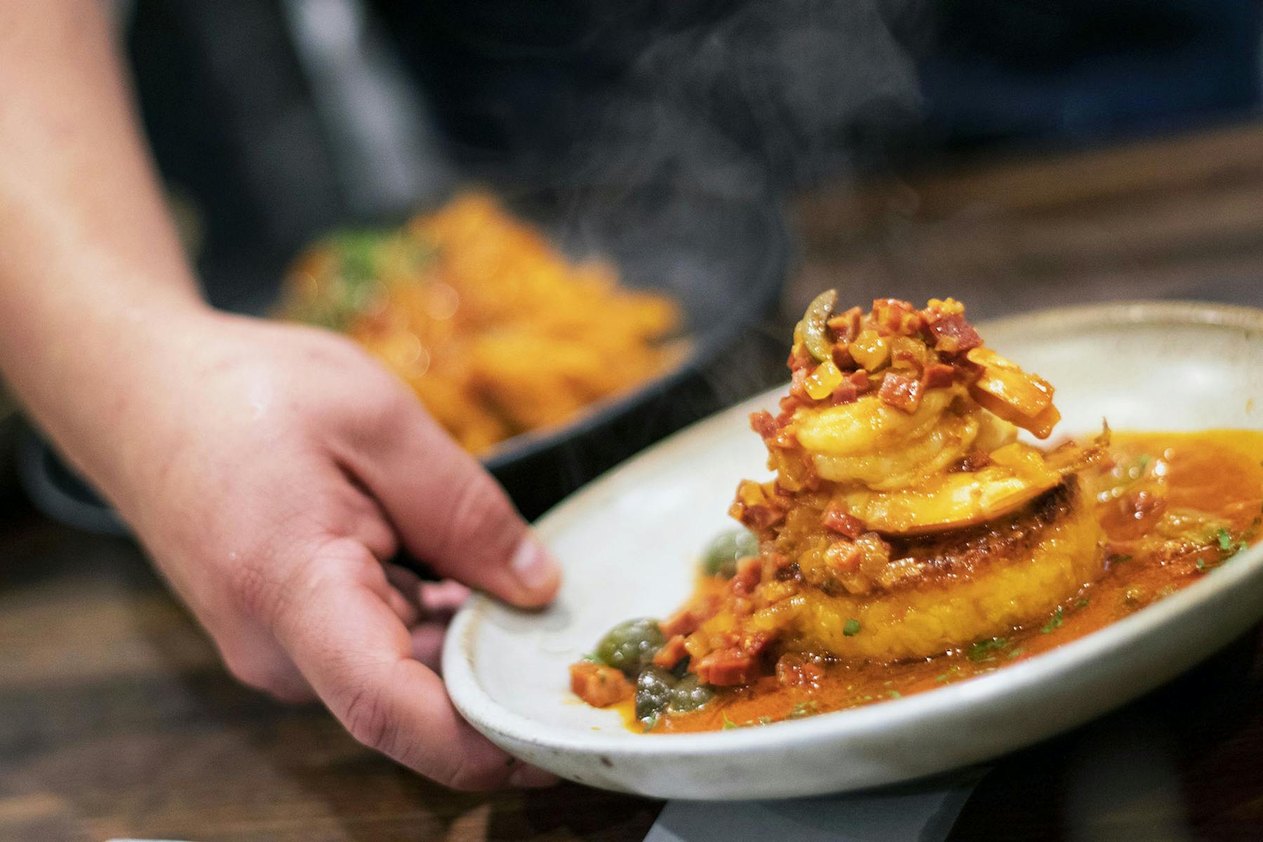 a person holding a plate of food
