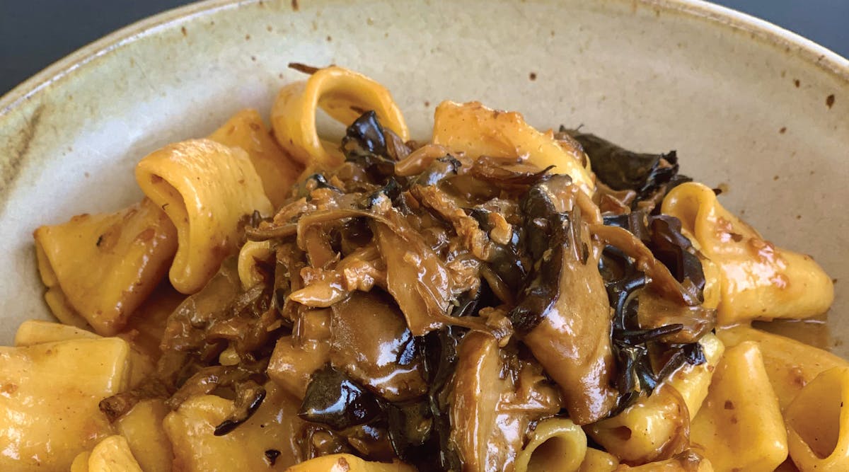 a bowl of noodles with sauce