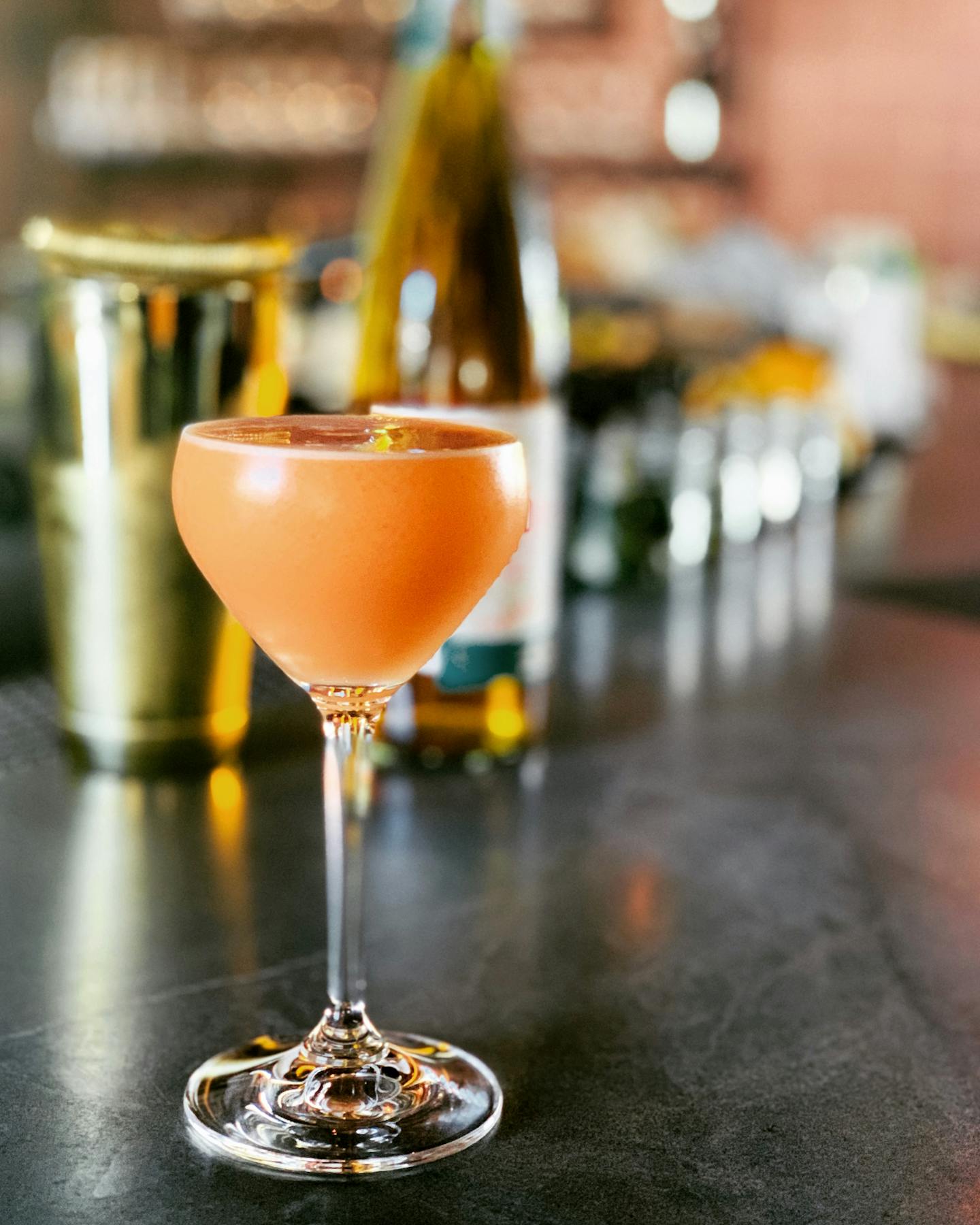 a close up of a wine glass sitting on a table