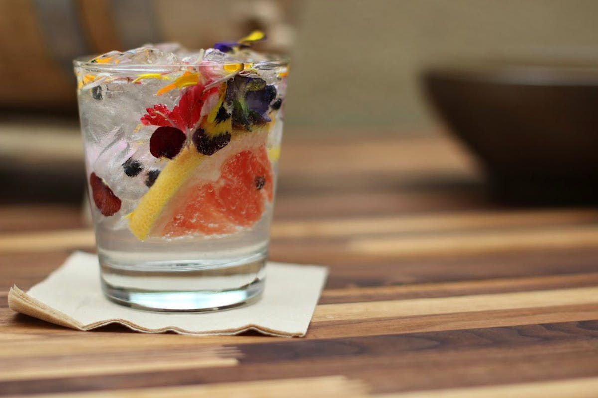 a close up of a cocktail drink sitting on a table