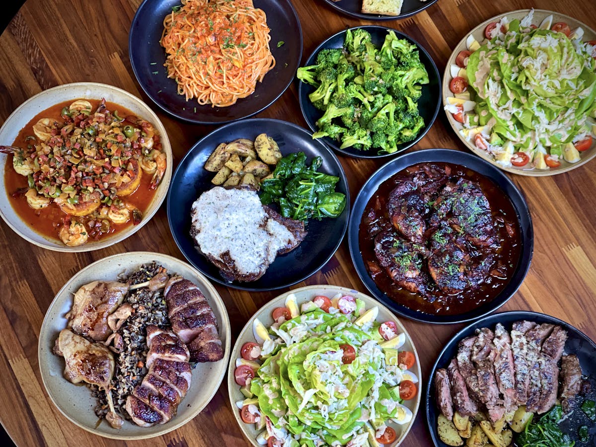 many different types of food on a wooden table