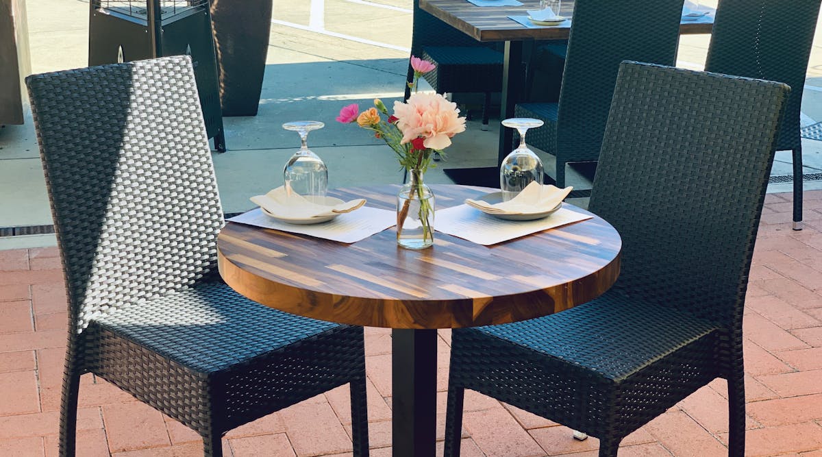 a chair sitting in front of a table
