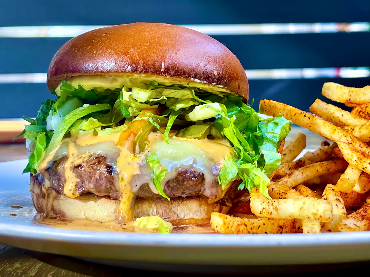 a cheeseburger and fries on a plate