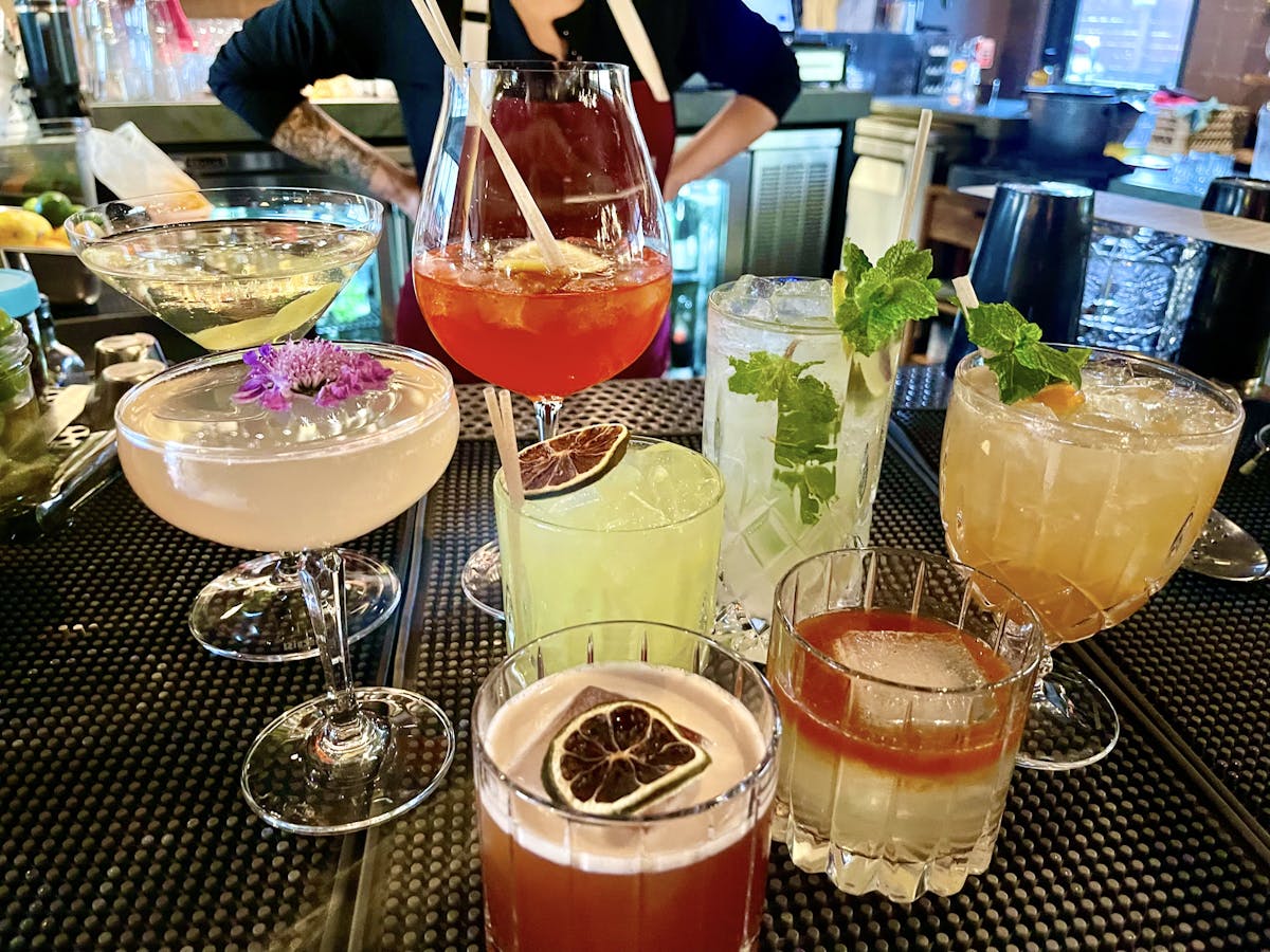 a person sitting at a table with a plate of food