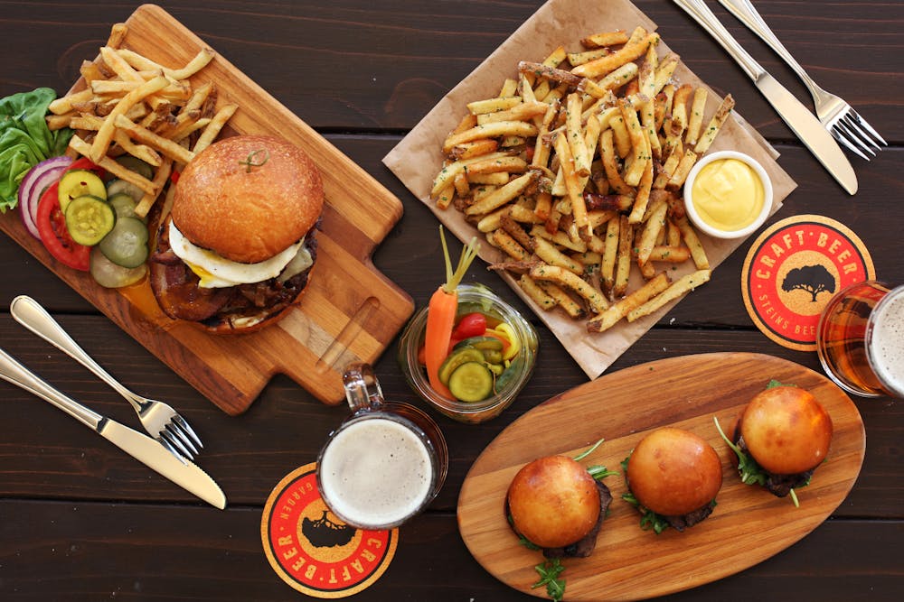 a bunch of food sitting on top of a wooden table