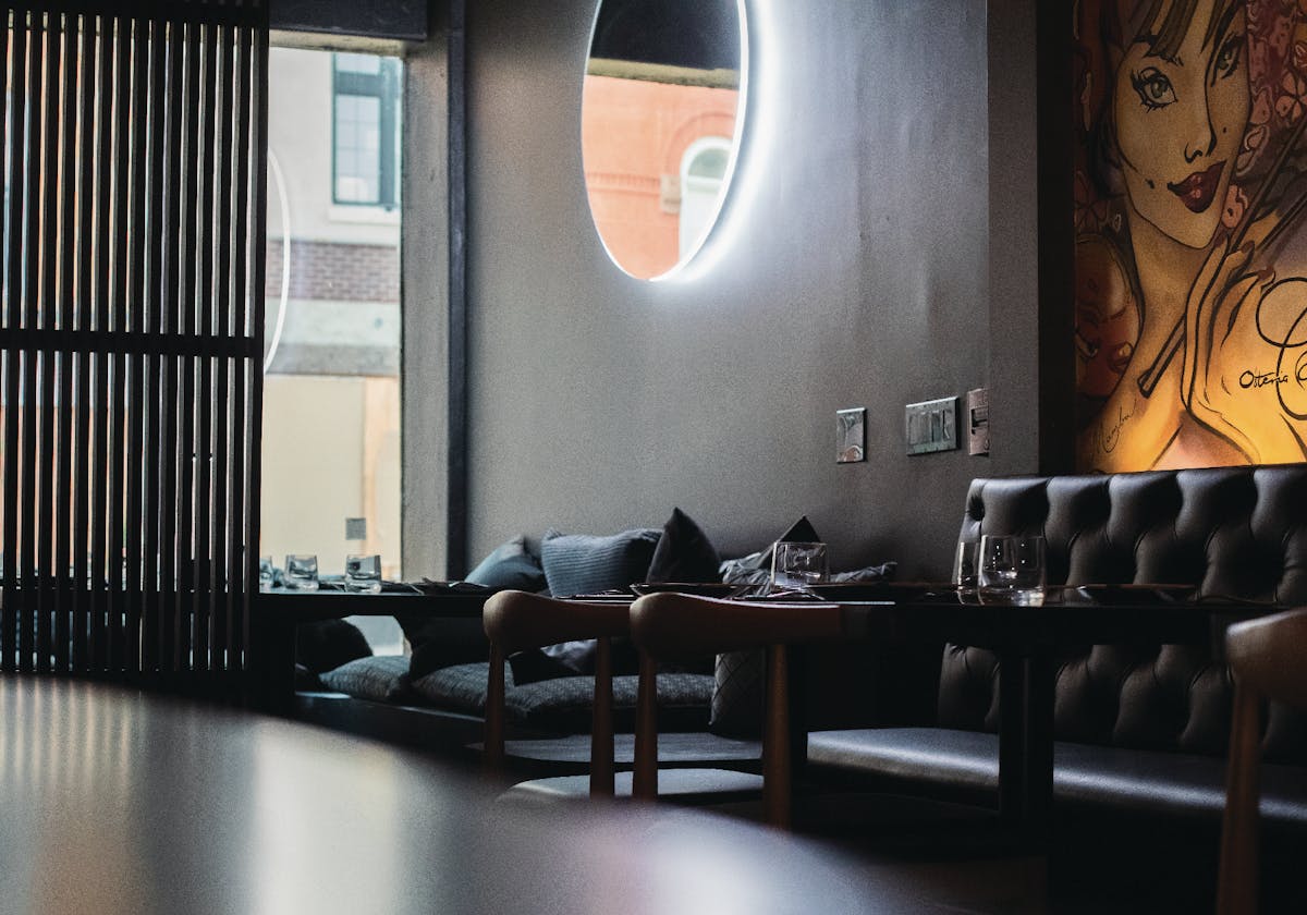 Cozy corner seating inside pastaRAMEN's Montclair BYOB ramen restaurant