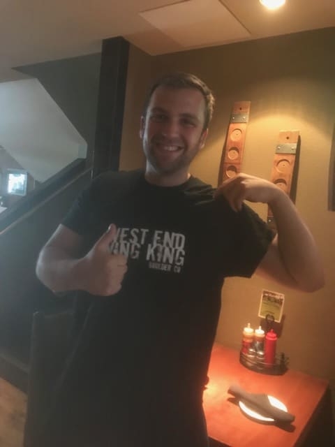 a person standing in front of a mirror posing for the camera