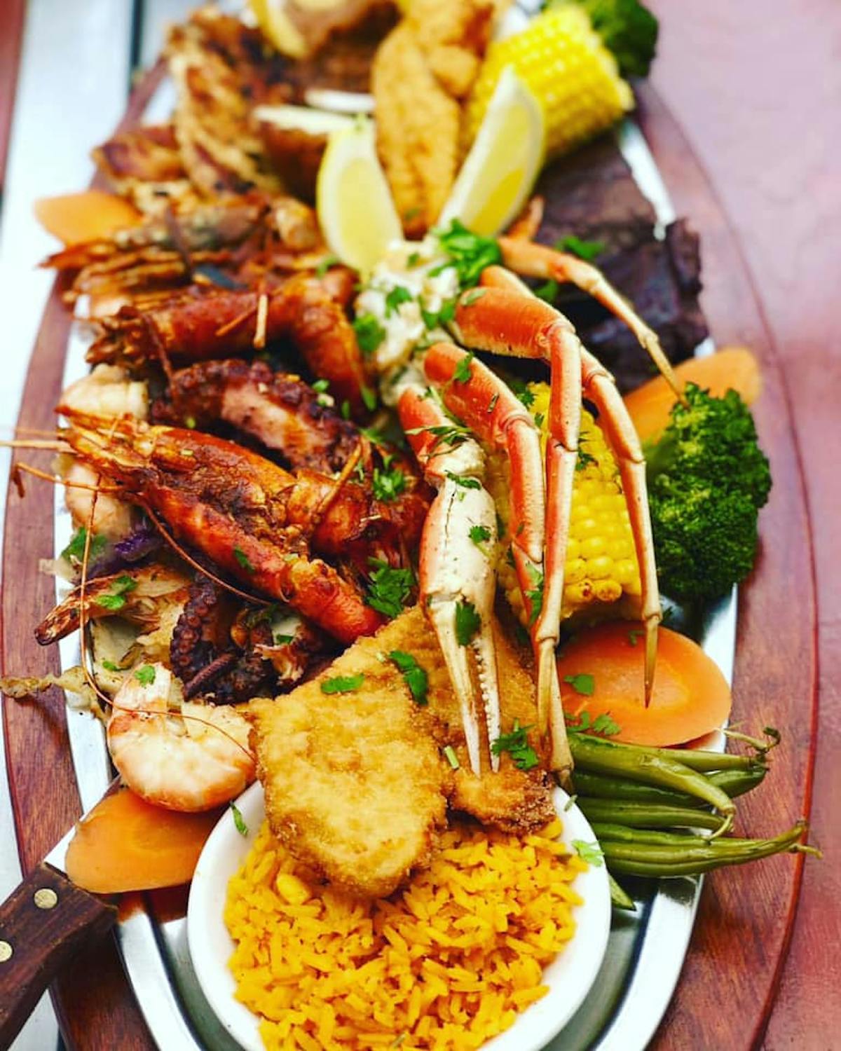a plate of food with meat and vegetables