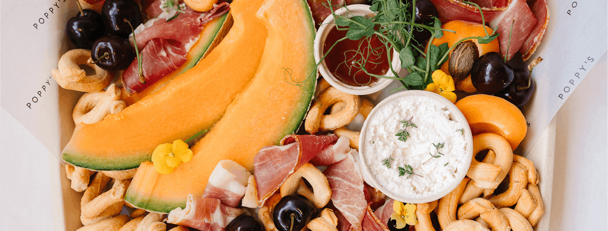 a plate of fresh fruit and vegetables