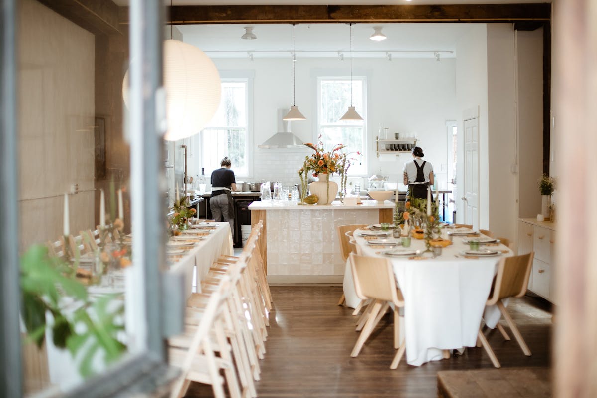 a dining room table in front of a window