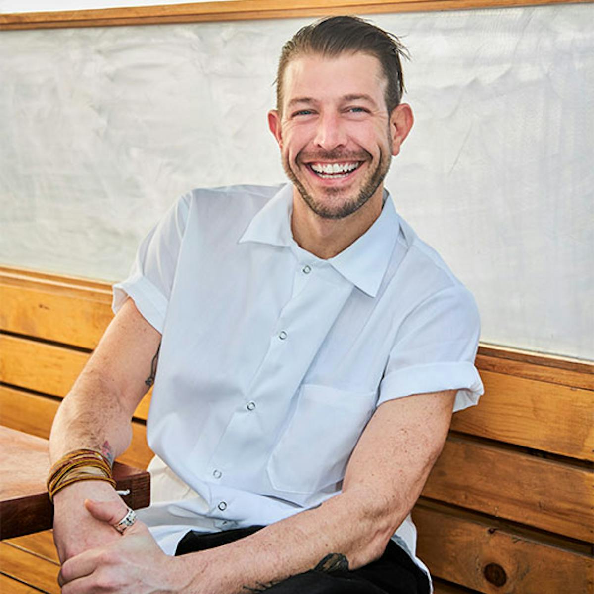 man sitting smiling