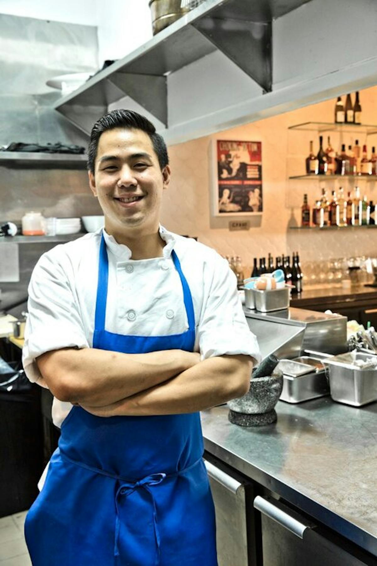 a person standing in a kitchen preparing food