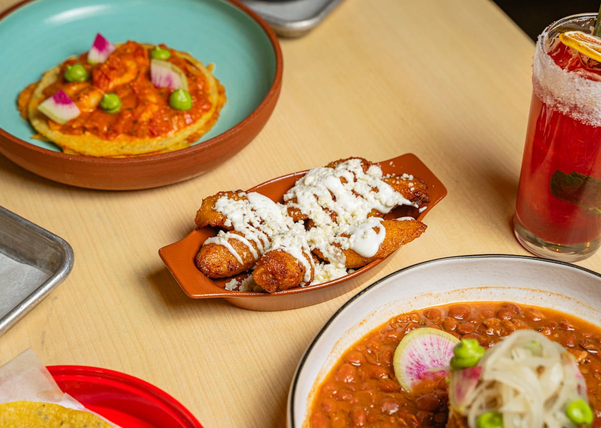 a bowl of food on a plate on a table