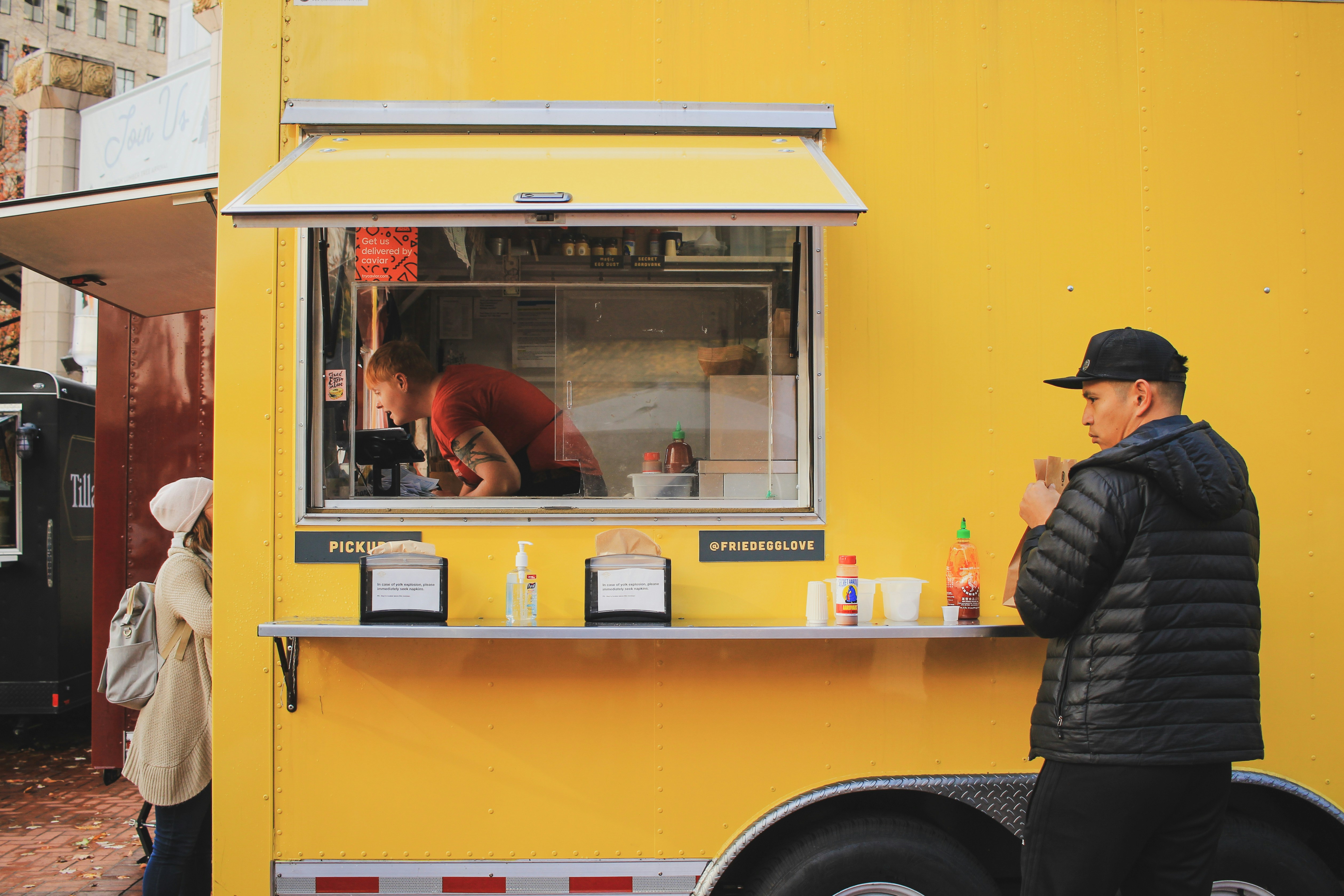 a person standing in front of a school bus