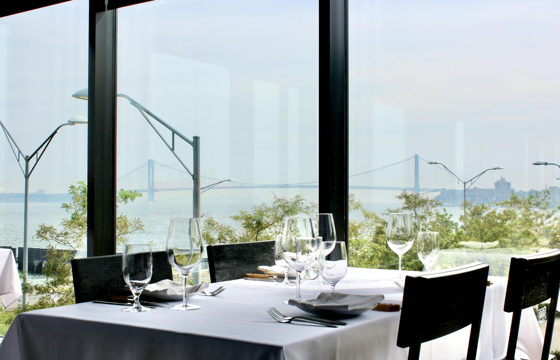 a dining room table in front of a window
