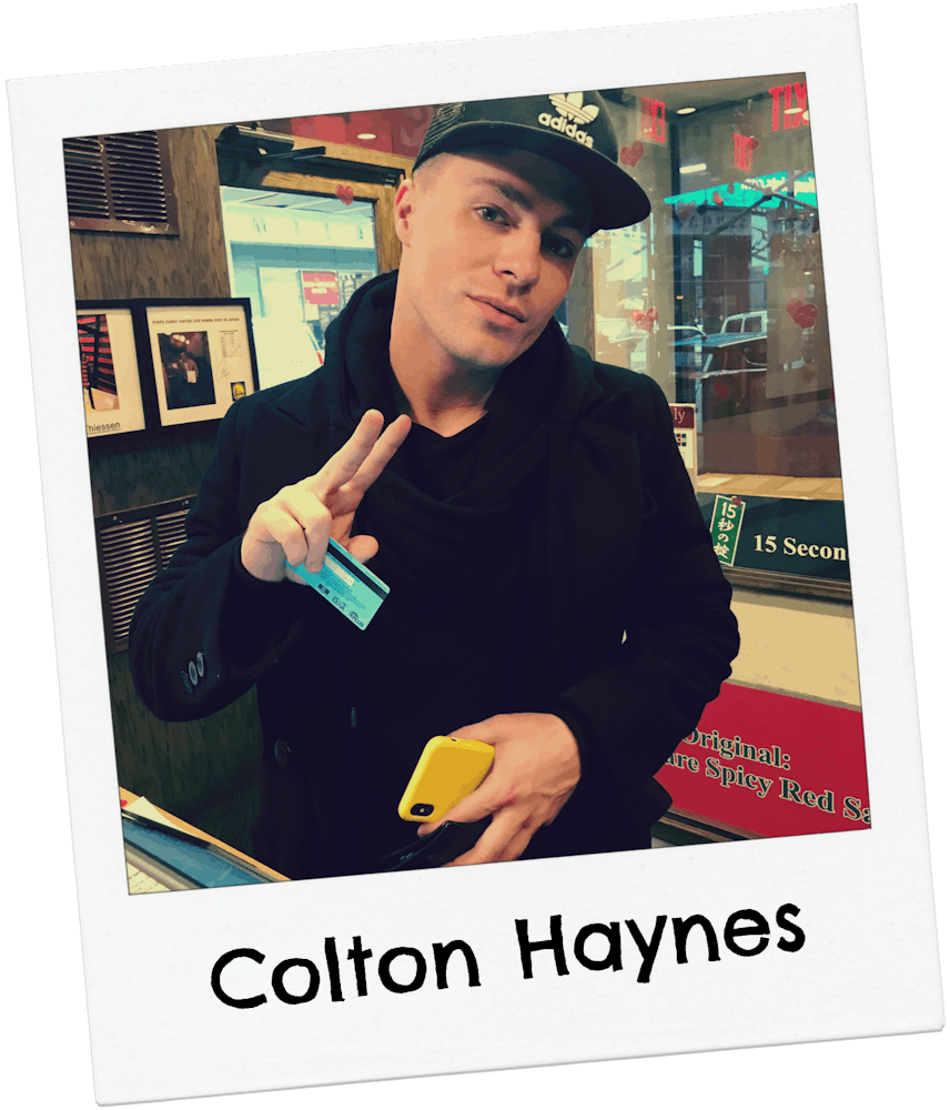 Colton Haynes giving peace sign