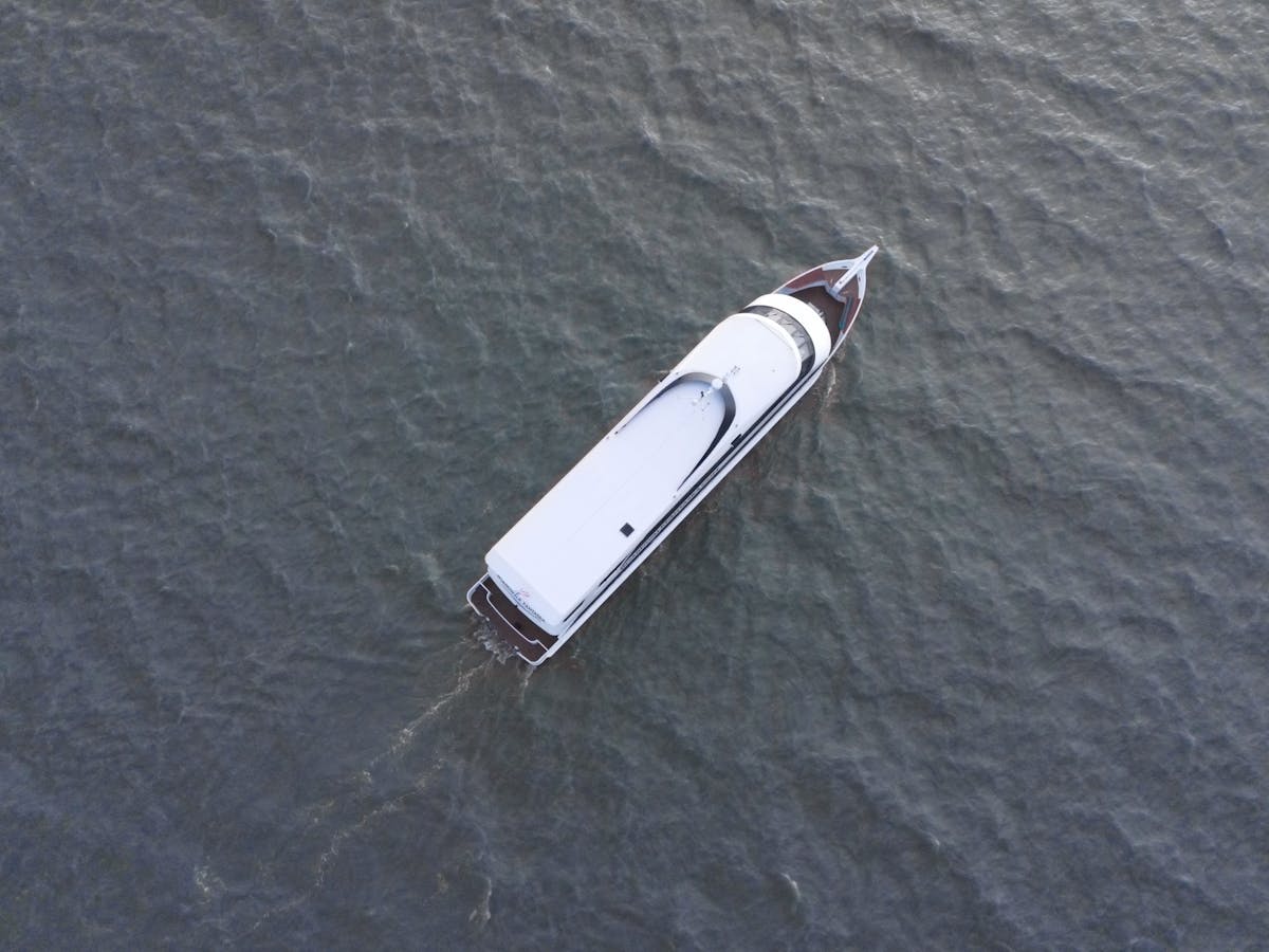 a person riding a surf board on a body of water