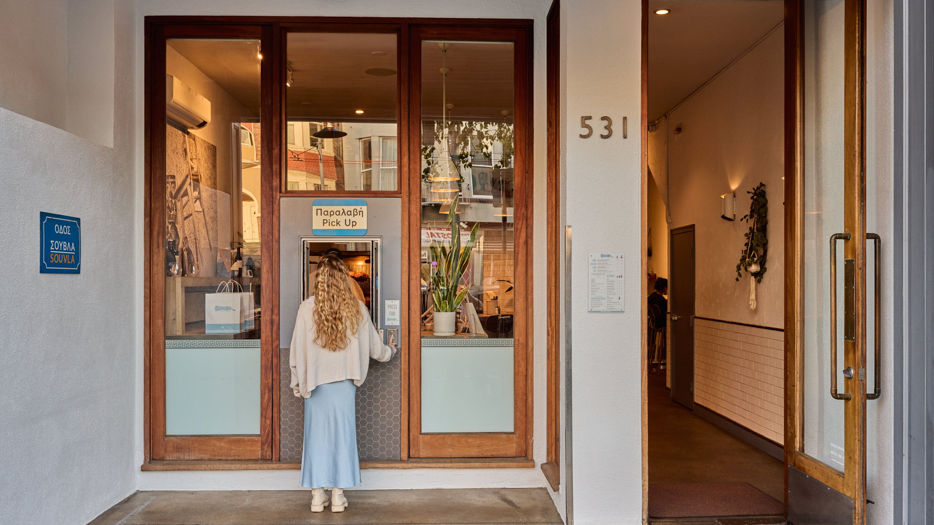 a woman standing in front of a building