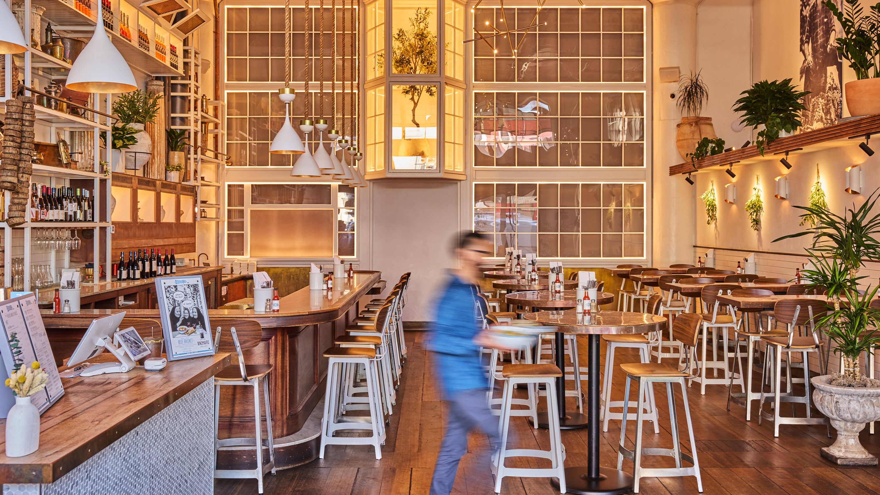 a man walking in a restaurant
