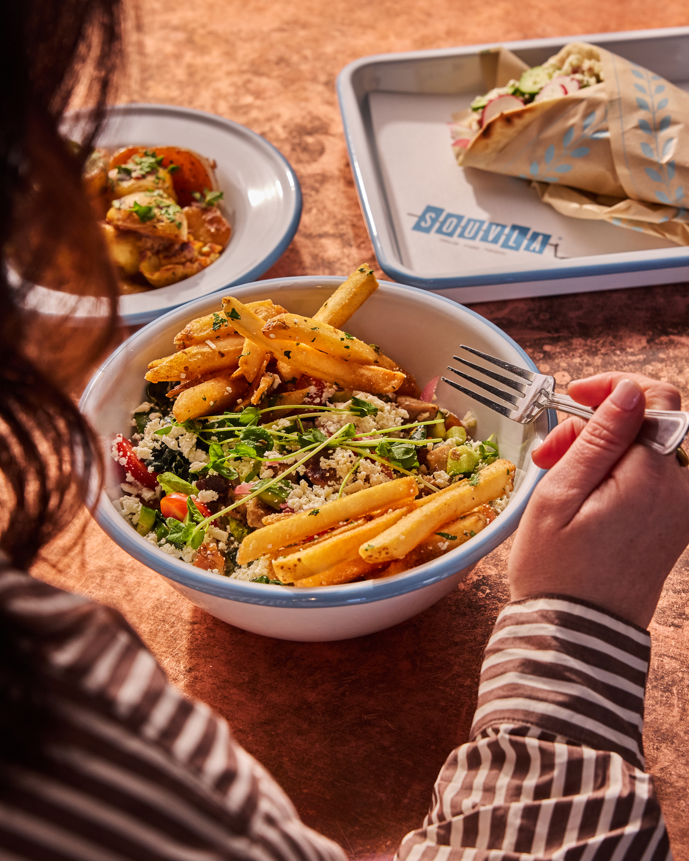 a person eating a bowl of food