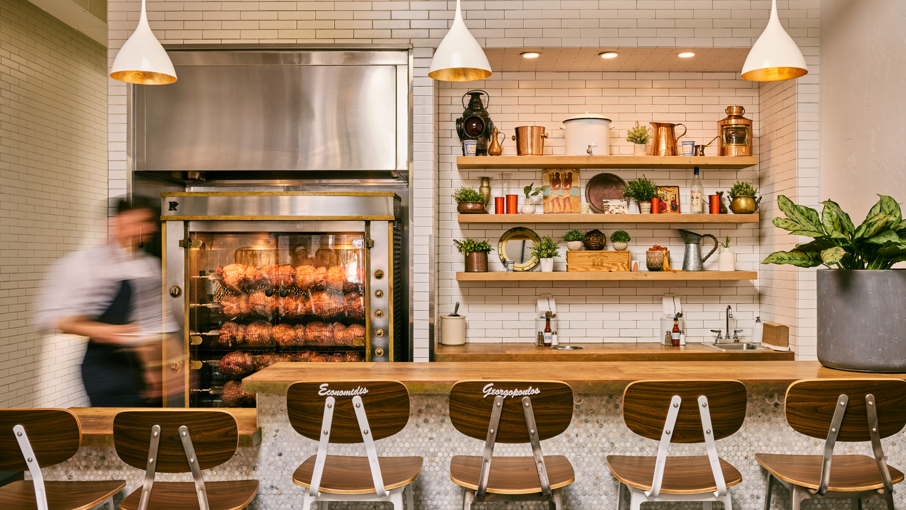 a restaurant with a counter and chairs