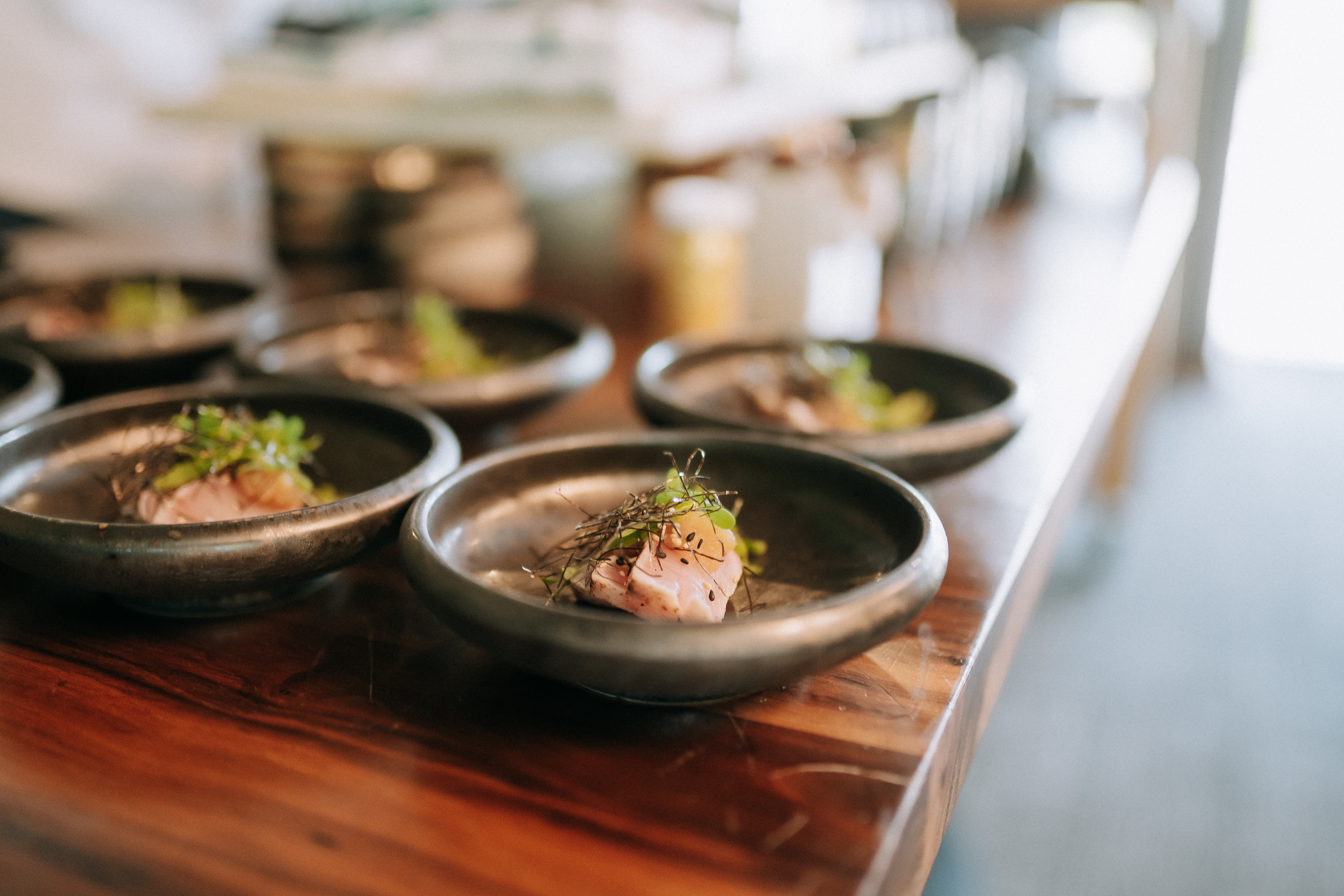 a group of small bowls of food on a table