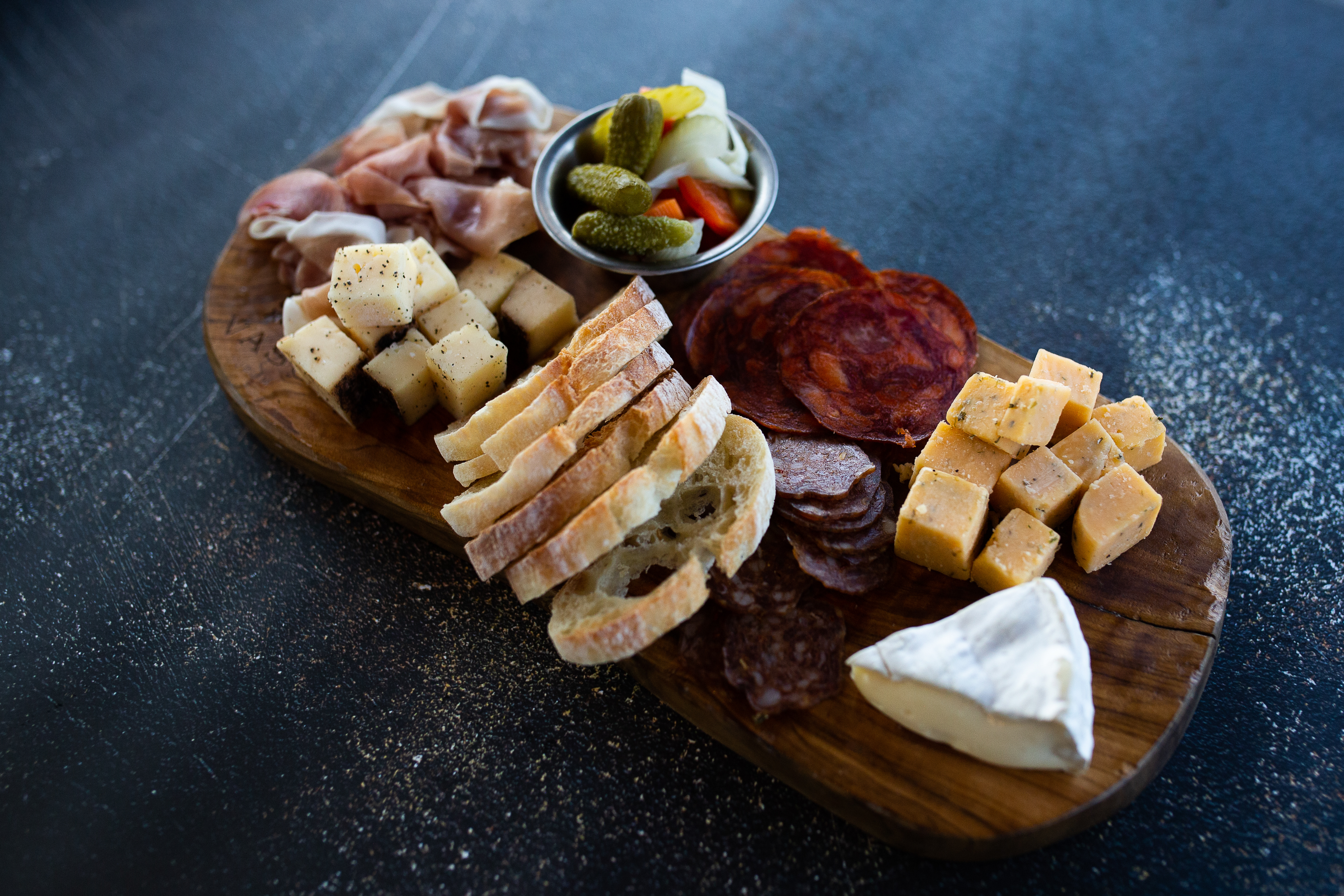 a board with different types of food on it