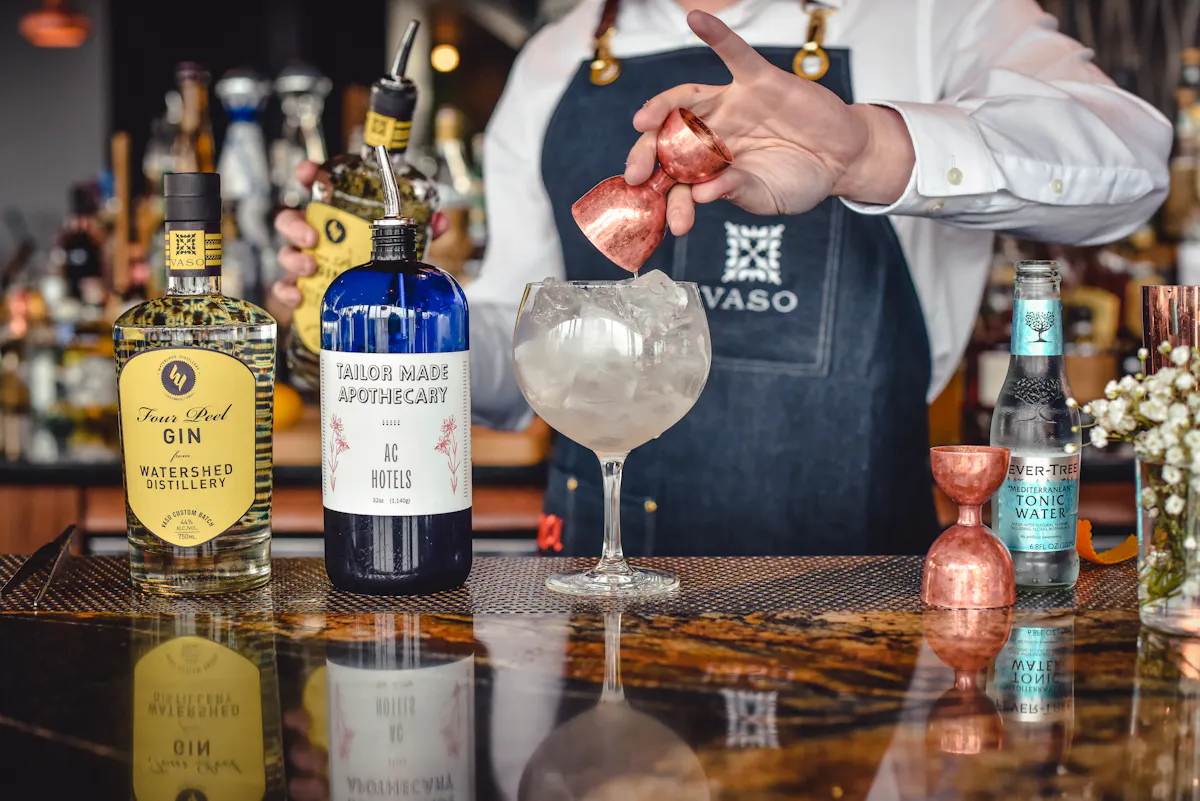 a person holding a bottle of wine