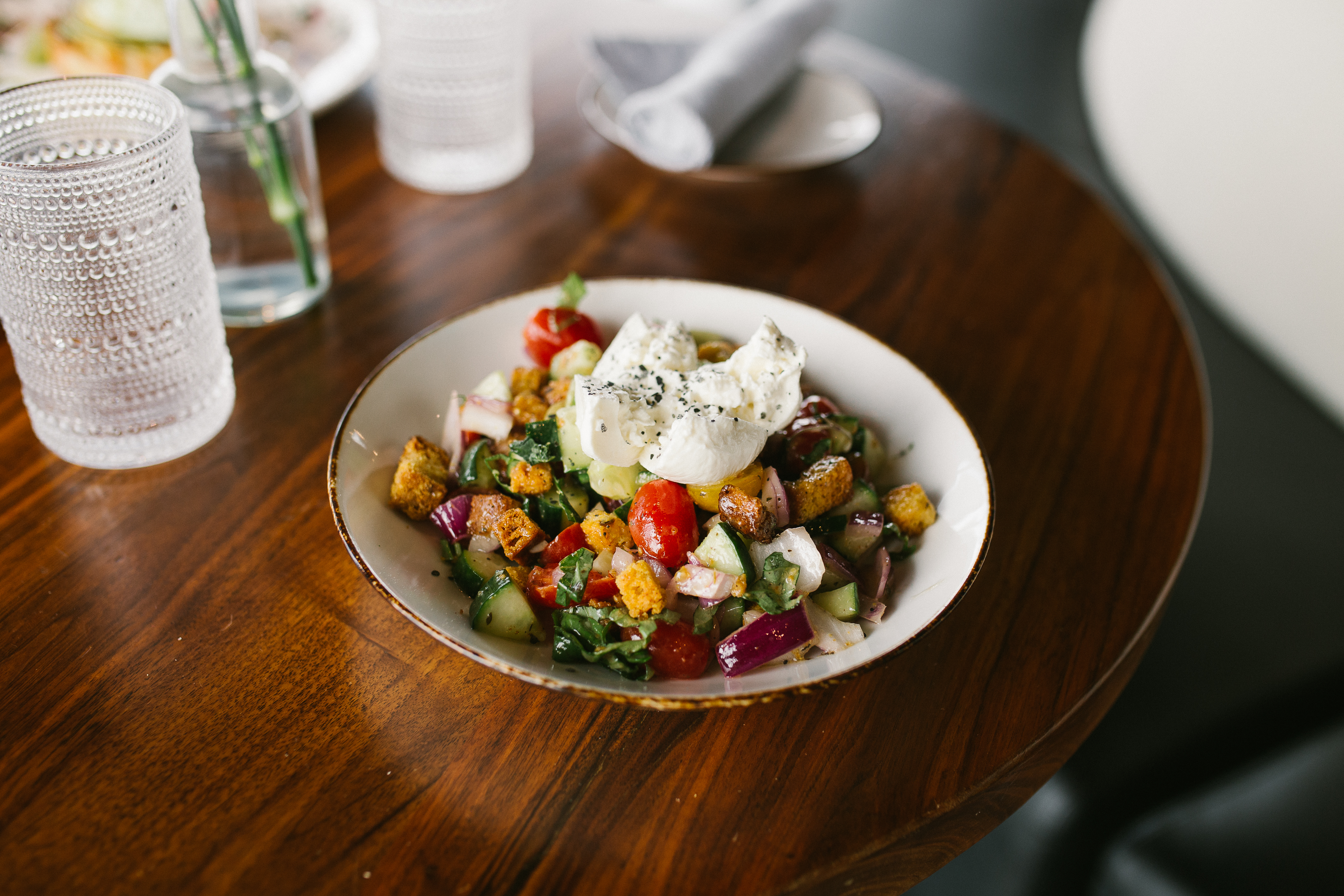 a bowl of salad on a table