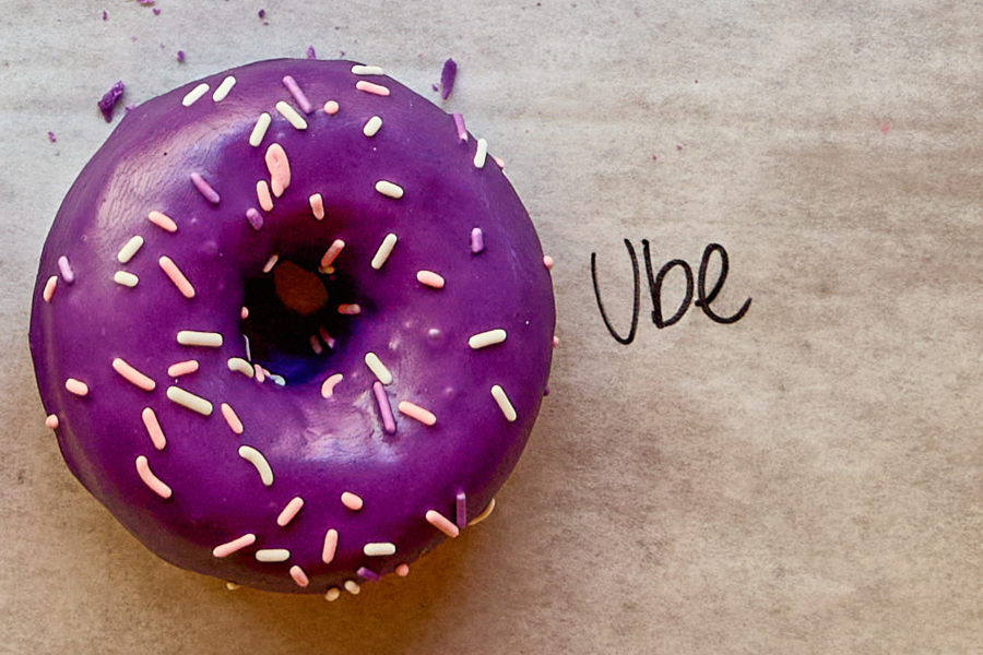 a purple donut with sprinkles