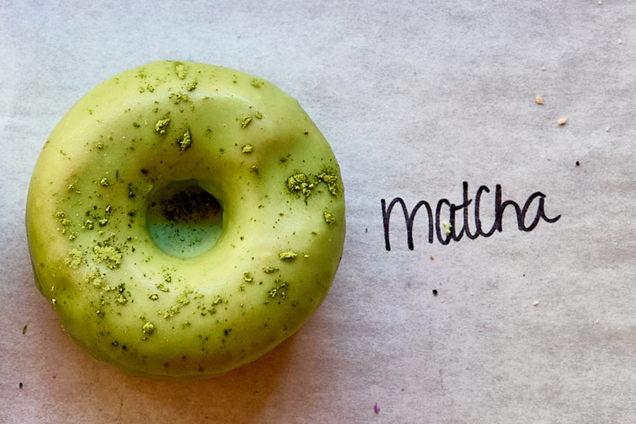 a green donut with a hole