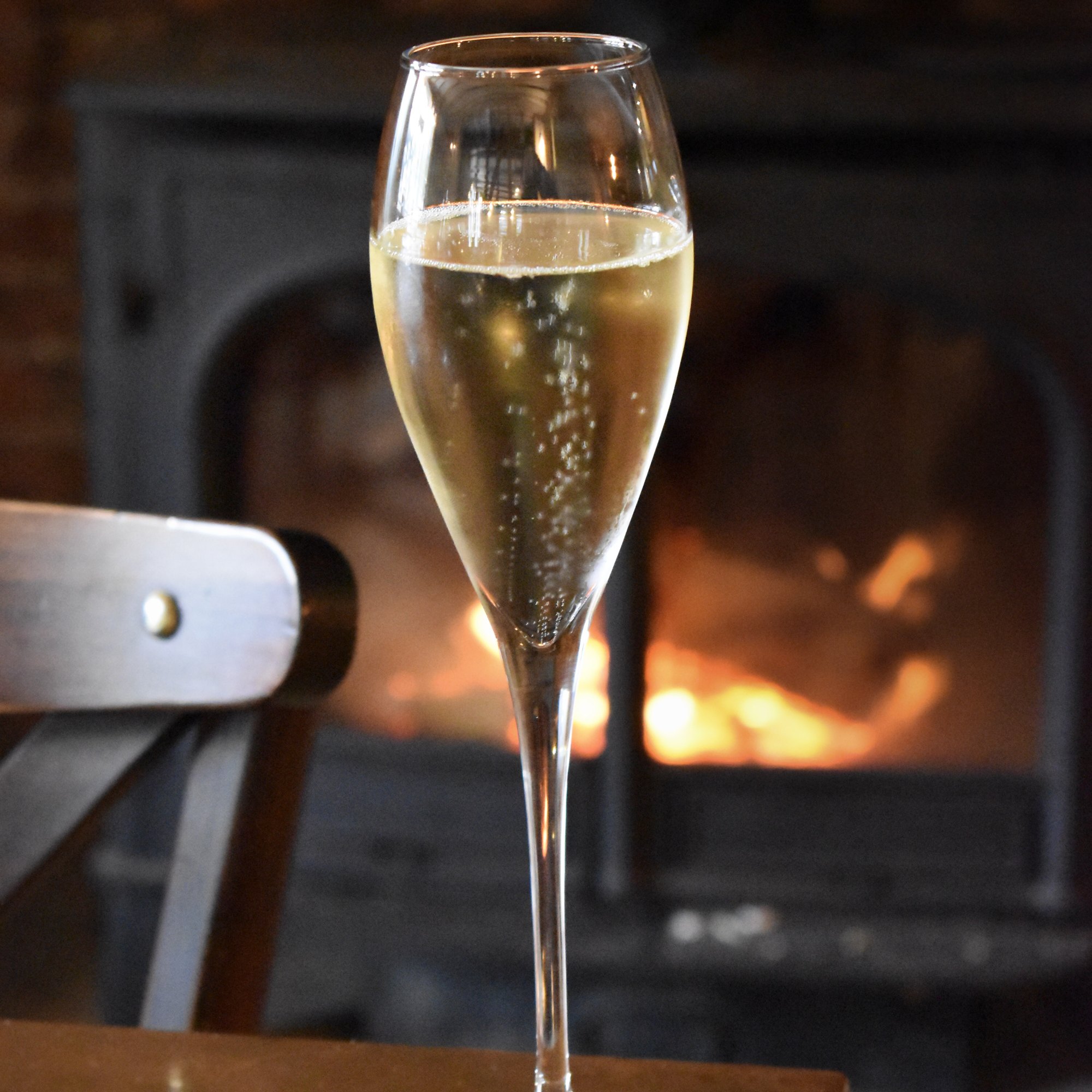 A glass of fizz by the fire at the Fox & Hounds, Barley