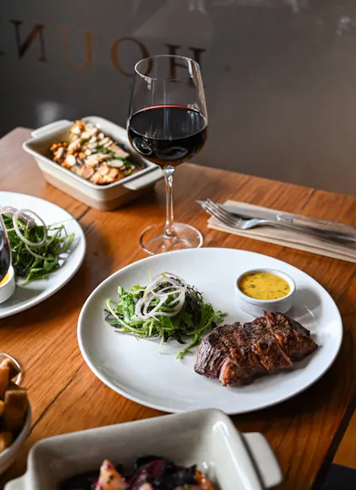 Picanha steak with salad, sides and red wine