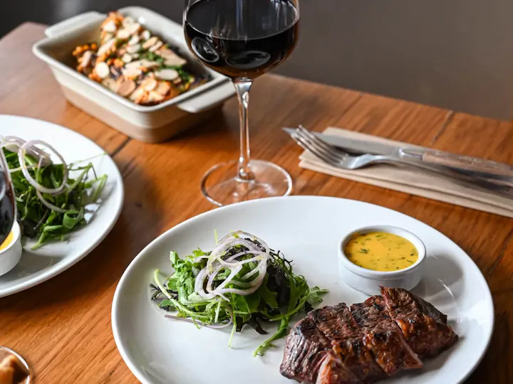 Picanha steak with salad, sides and red wine