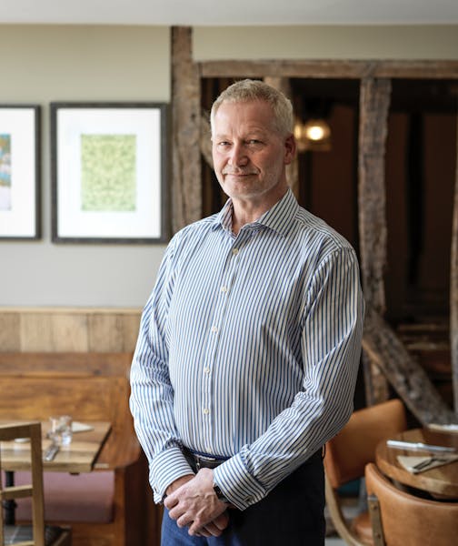 a man standing in front of a table