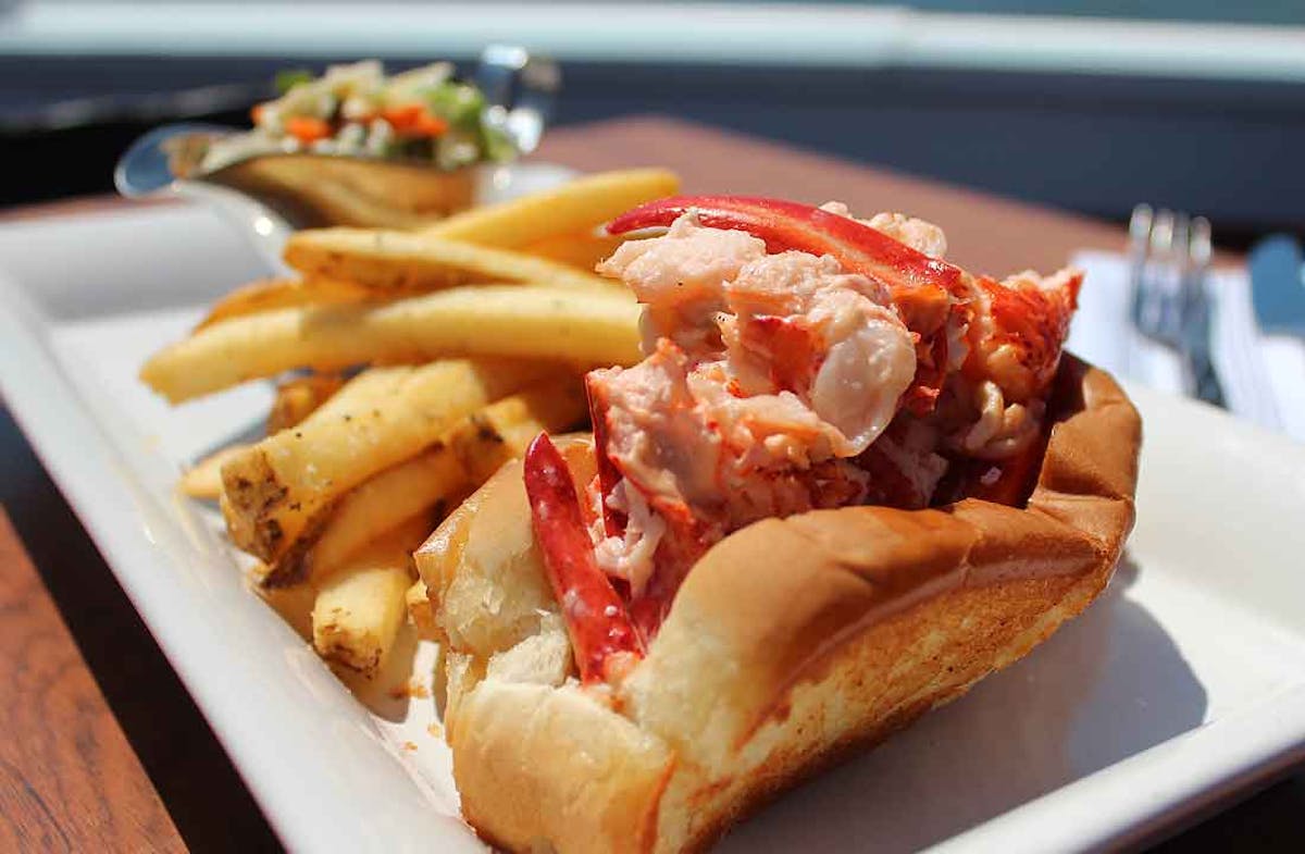 a close up of a plate of food with a hot dog